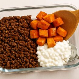 Finished high-protein hot honey beef bowl on a clean kitchen counter