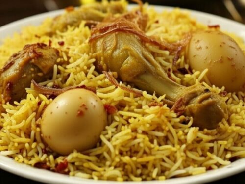 Authentic Kolkata chicken dum biryani served with potato and egg