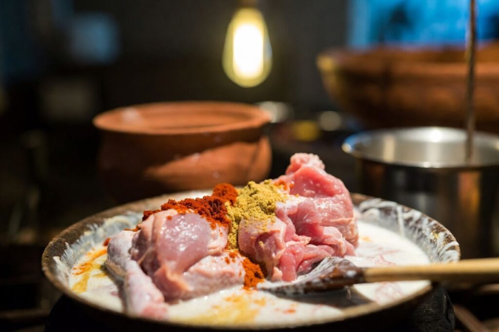 Chicken marinated with yogurt and spices for Kolkata chicken dum biryani recipe