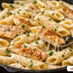 Rich and creamy garlic chicken pasta made with a budget-friendly milk slurry.