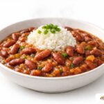 A simple, authentic bowl of meatless red beans and rice with sautéed onions.